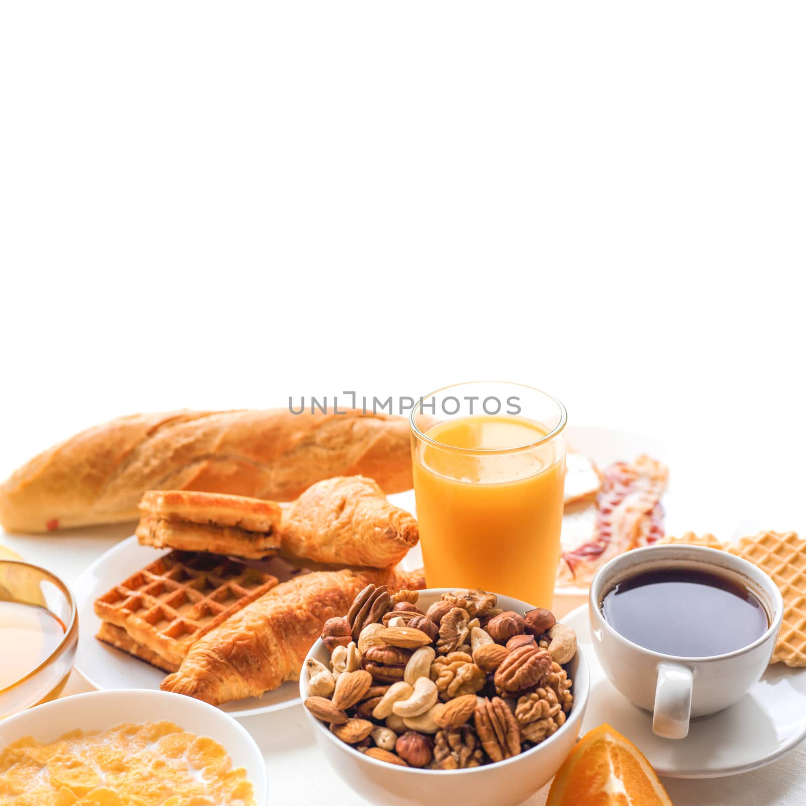 Healthy breakfast with juice ,nuts, coffee, eggs, bread, oat grains and other isolated on white background. White copy space for text, frame