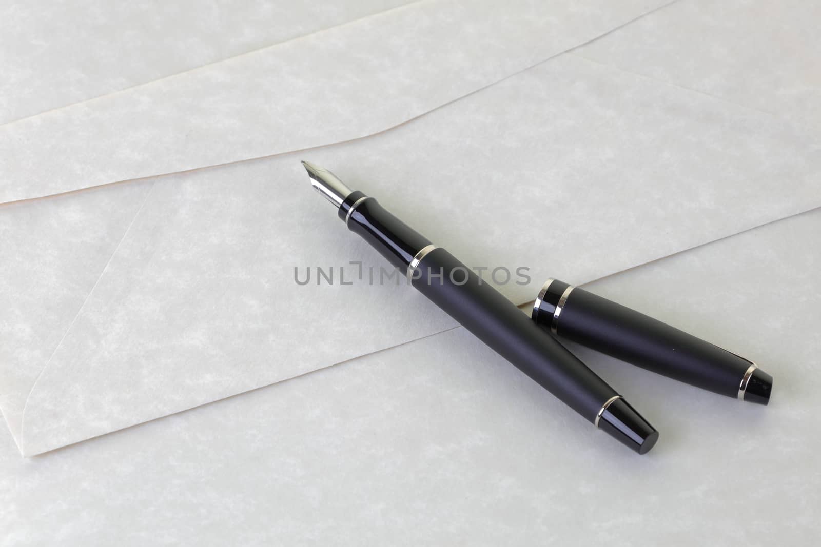A pen letter and writing paper with envelope