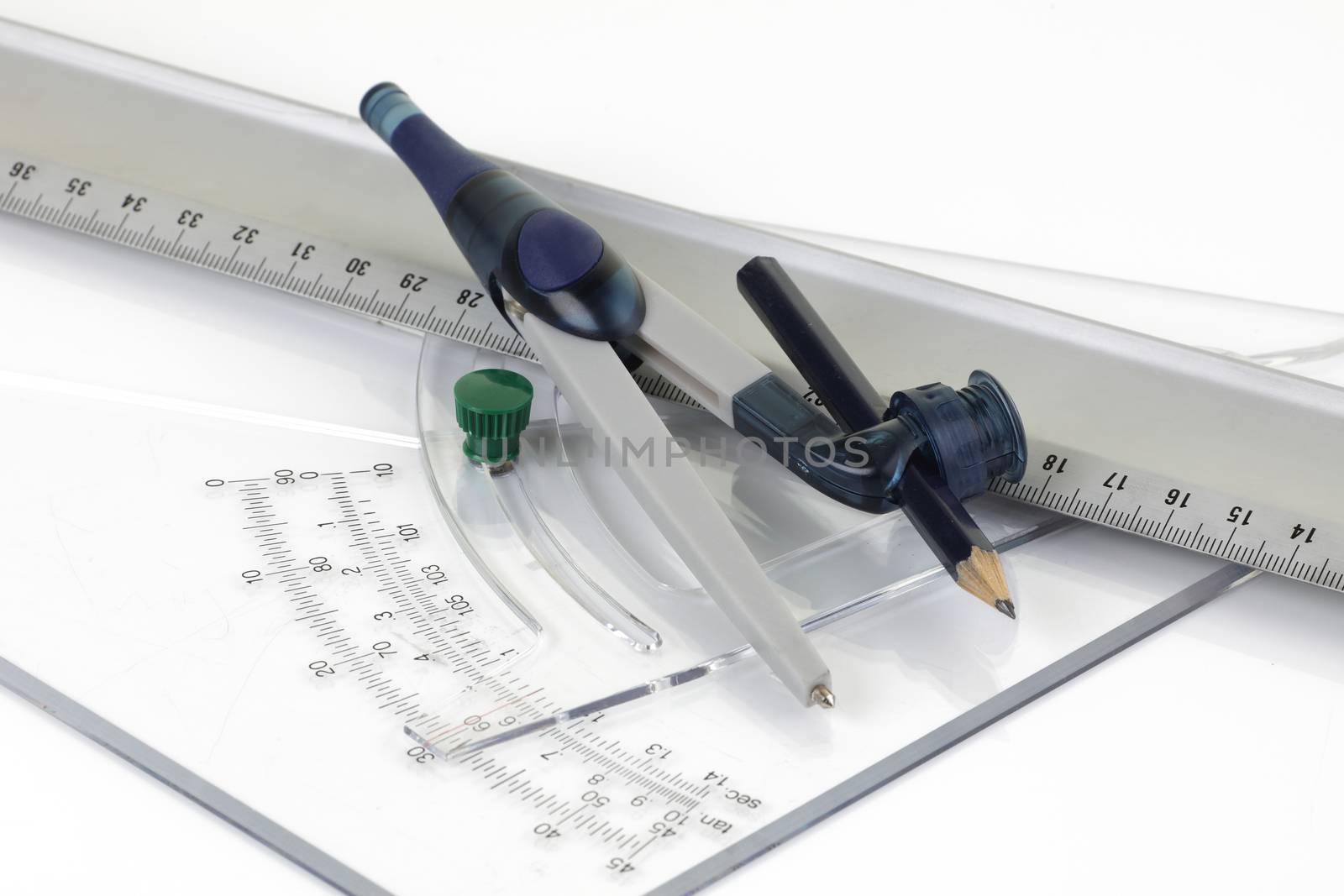 A set of technical drawing tools ruler protractor pair of compasses