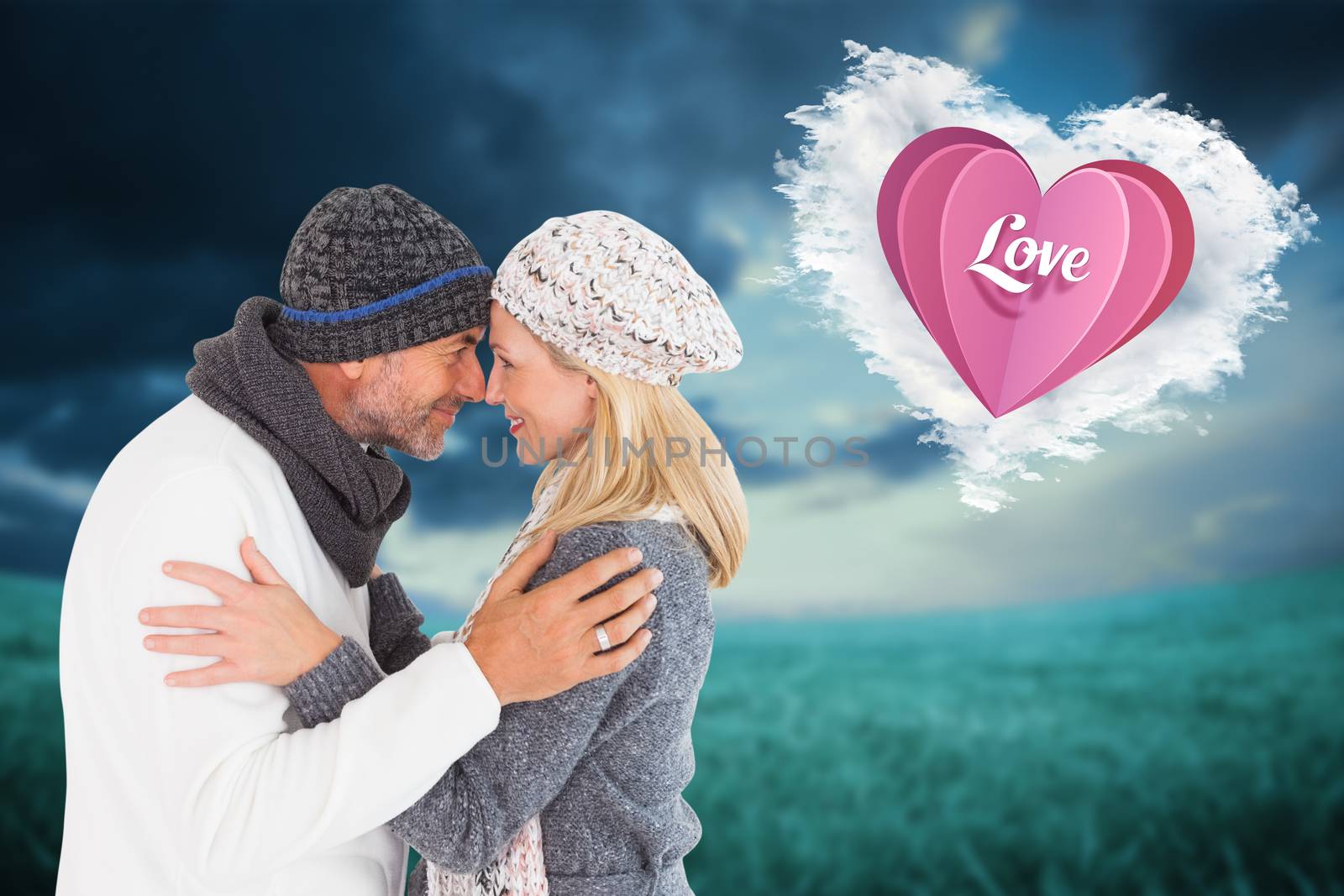 Composite image of happy couple in winter fashion embracing by Wavebreakmedia