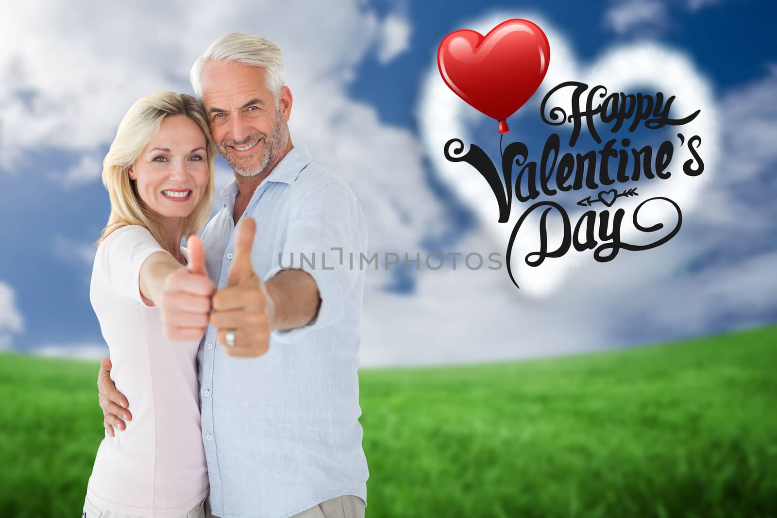 Smiling couple showing thumbs up together against green field under blue sky