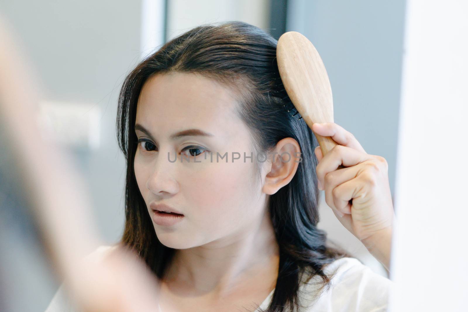 Woman serious hair loss problem for health care shampoo and beauty product concept, selective focus