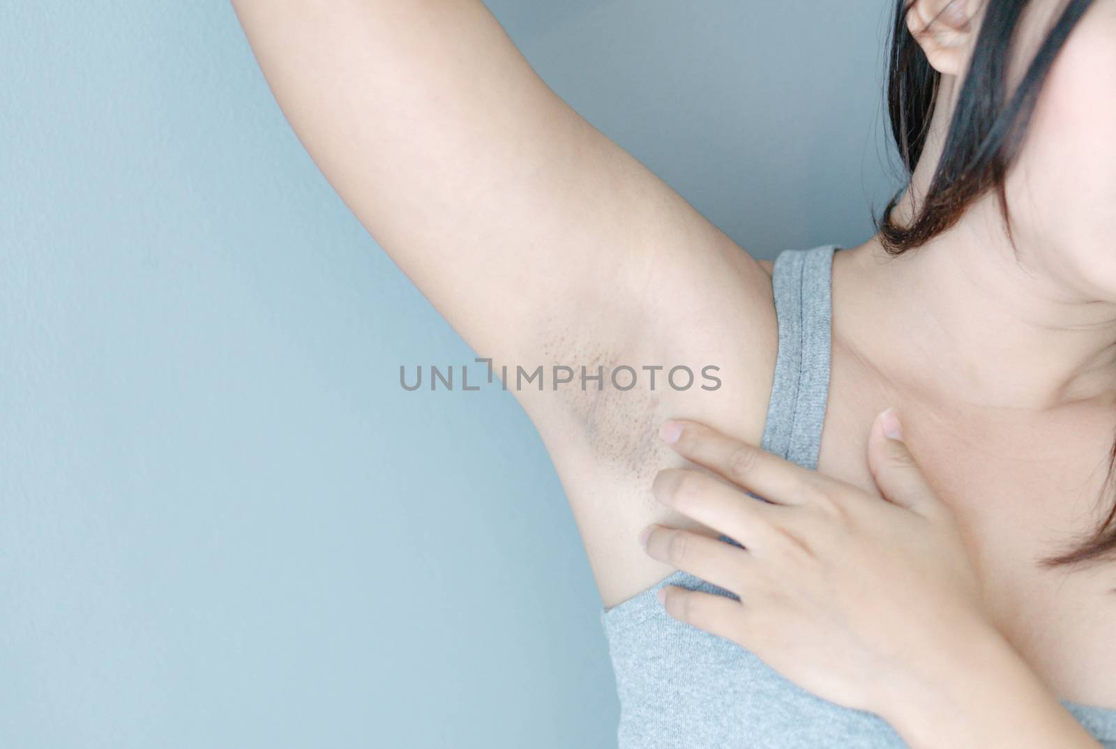 Women problem black armpit with grey background for skin care an by pt.pongsak@gmail.com