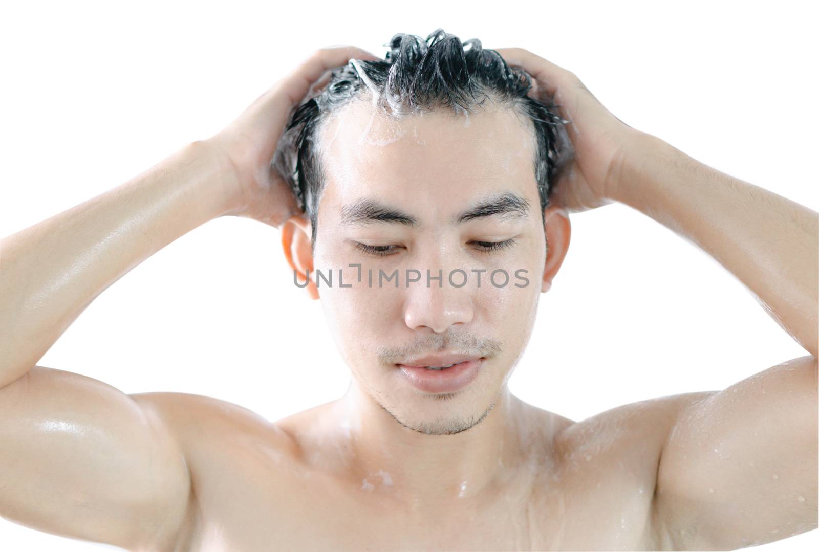 Closeup young man washing hair with shampoo isoleted on white background