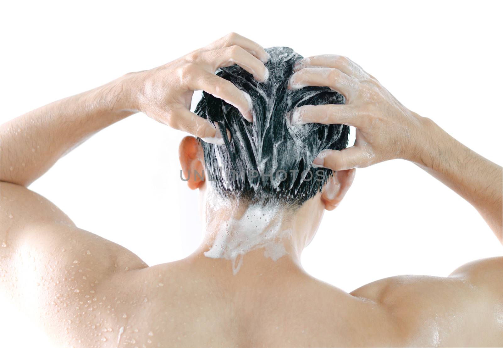 Closeup young man washing hair with shampoo isoleted on white background