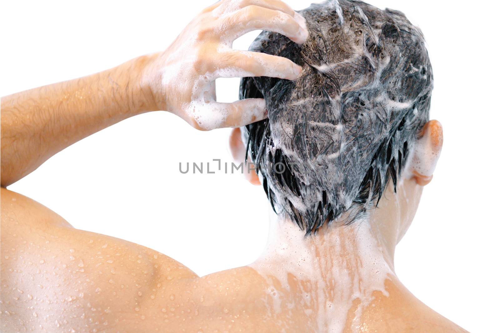 Closeup young man washing hair with shampoo isoleted on white background