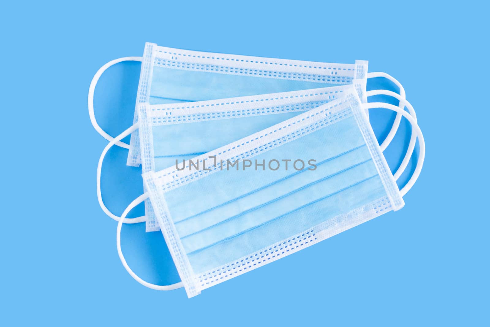 Medical mask isolated on blue background for protect air polution or virus covid 19, health care concept