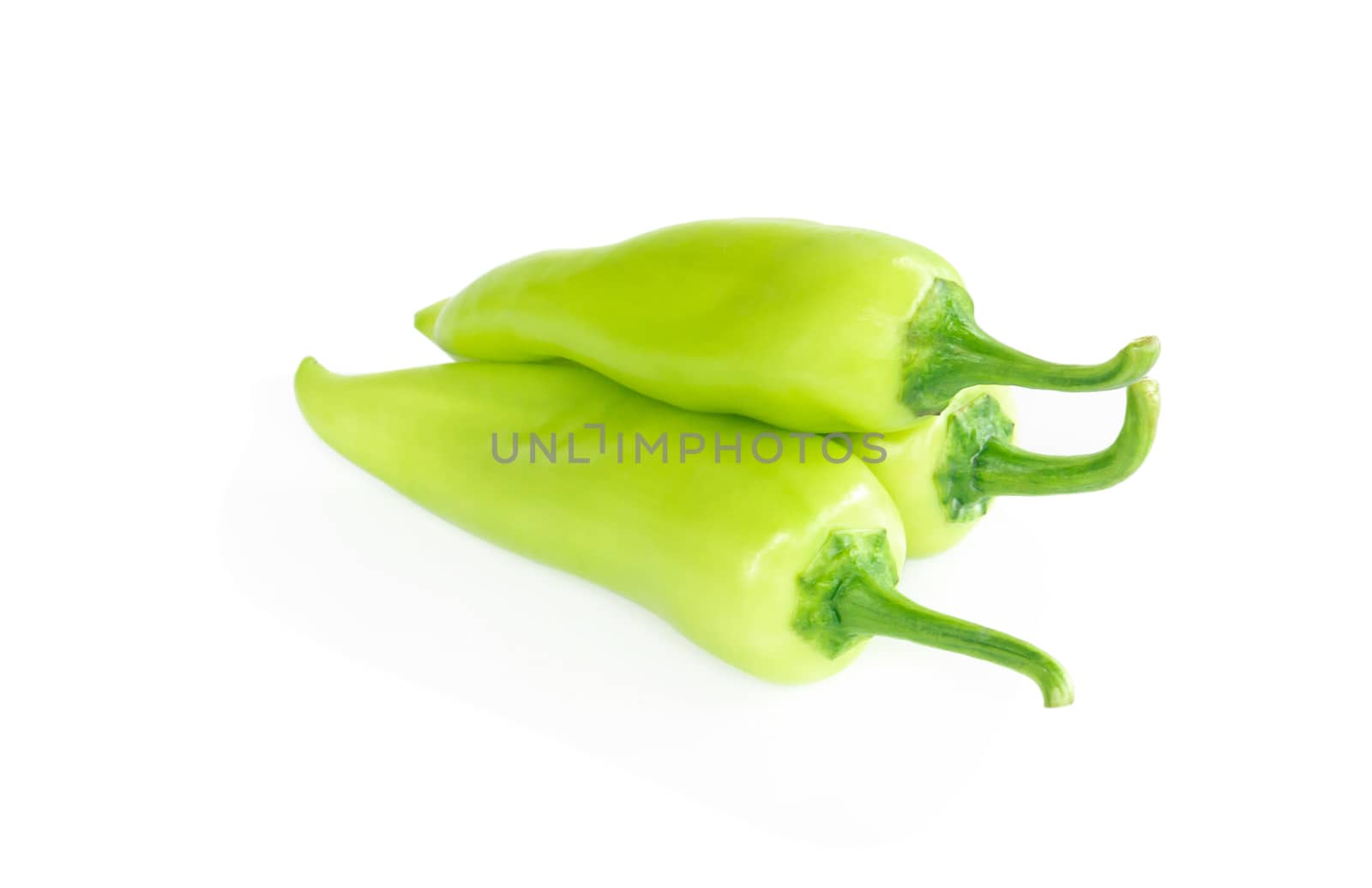 Green chilli pepper on white background, raw food ingredient concept