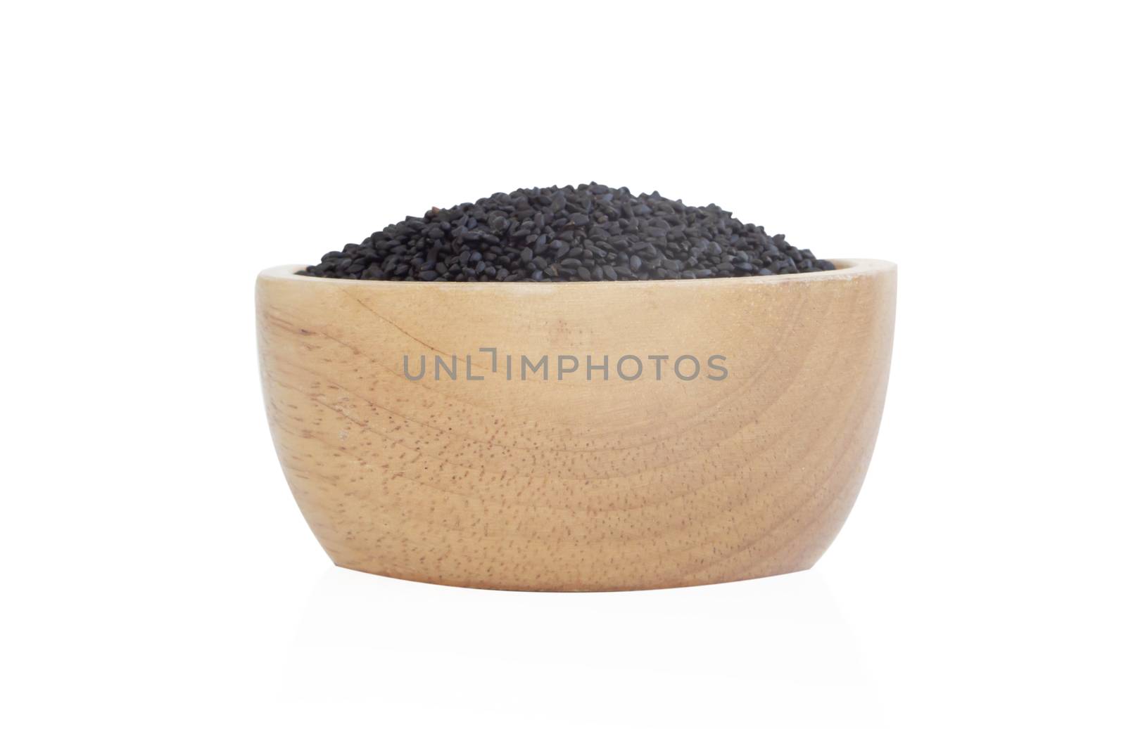 Closeup black sesame seeds in wooden bowl on white background, healthy food concept