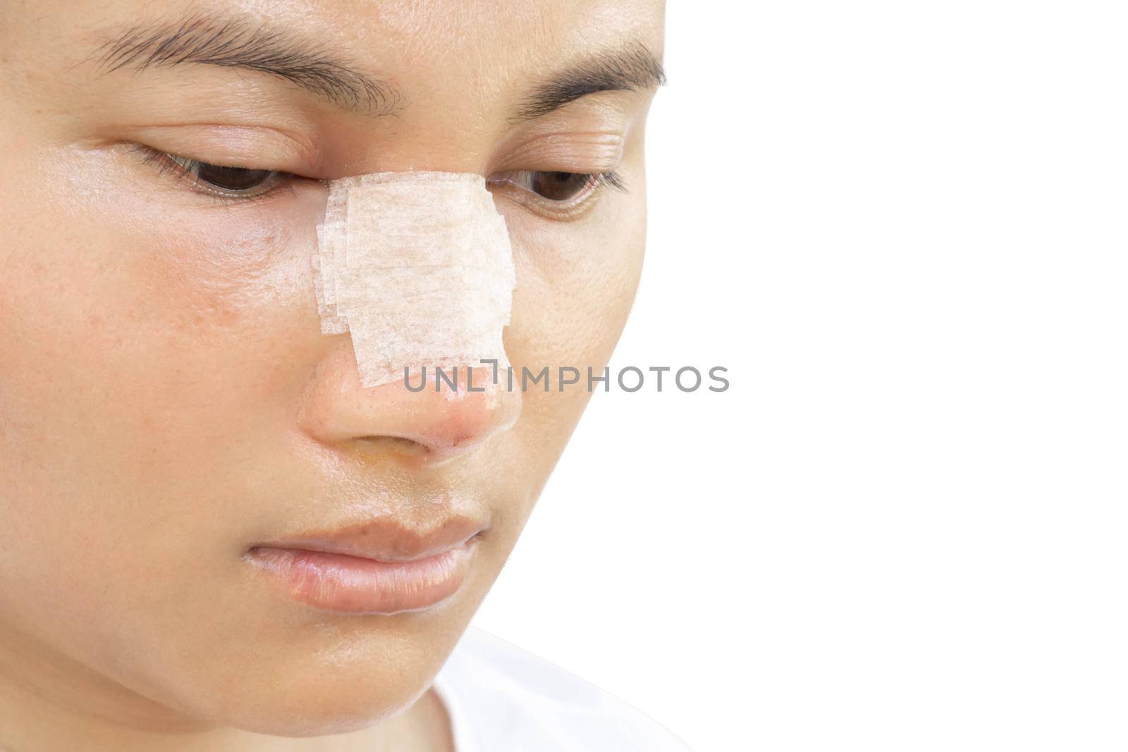 Close up face of asian woman with nose plastic surgery for beauty and cosmetic conept, white background