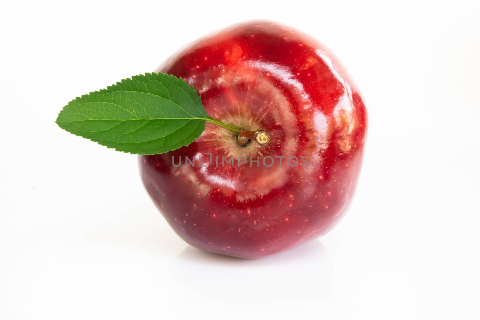 Fresh red apple fruit with green leaf isolated on white background, Healthy food concept