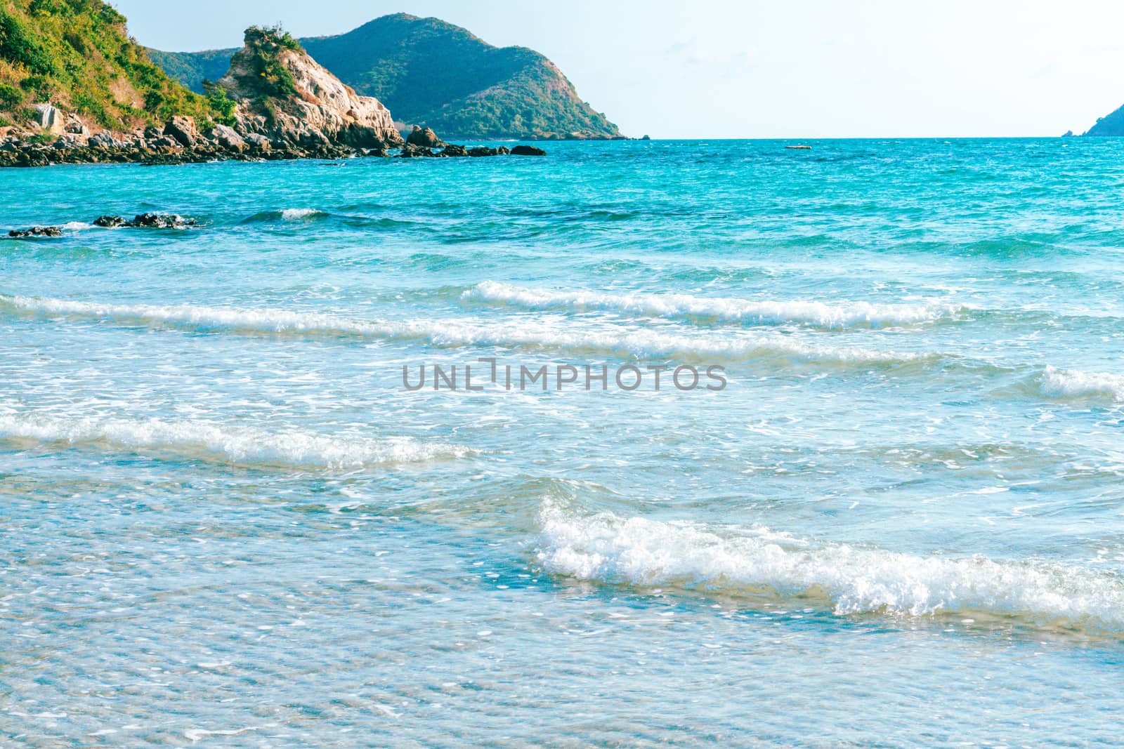 Sea wave breaking with rocky beach, Holiday and relax time concept, selective focus