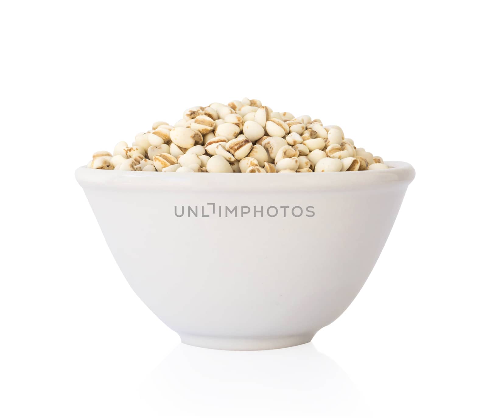 Job's tears in ceramic bowl on white background, healthy food concept