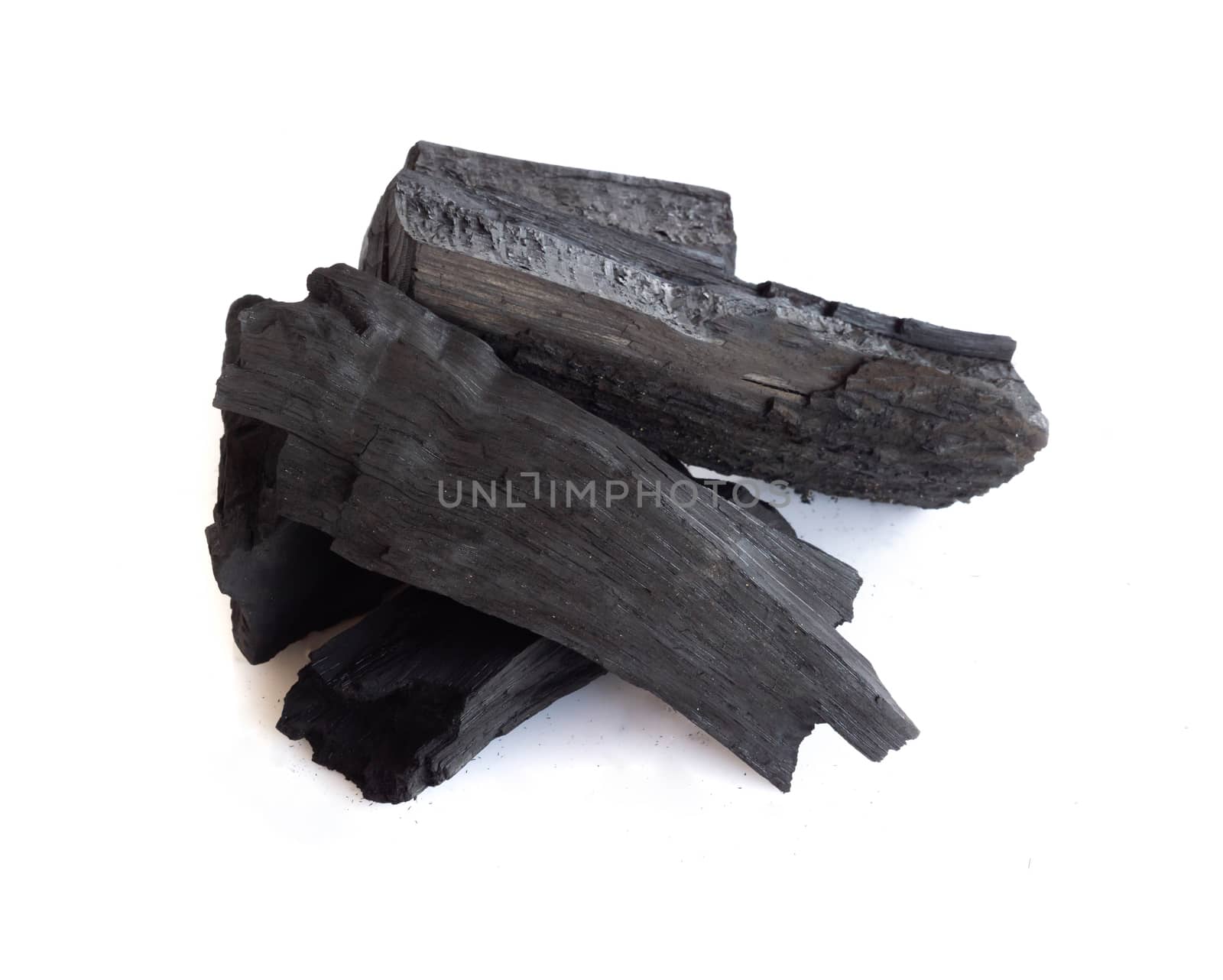 Natural black charcoal isolated on white background