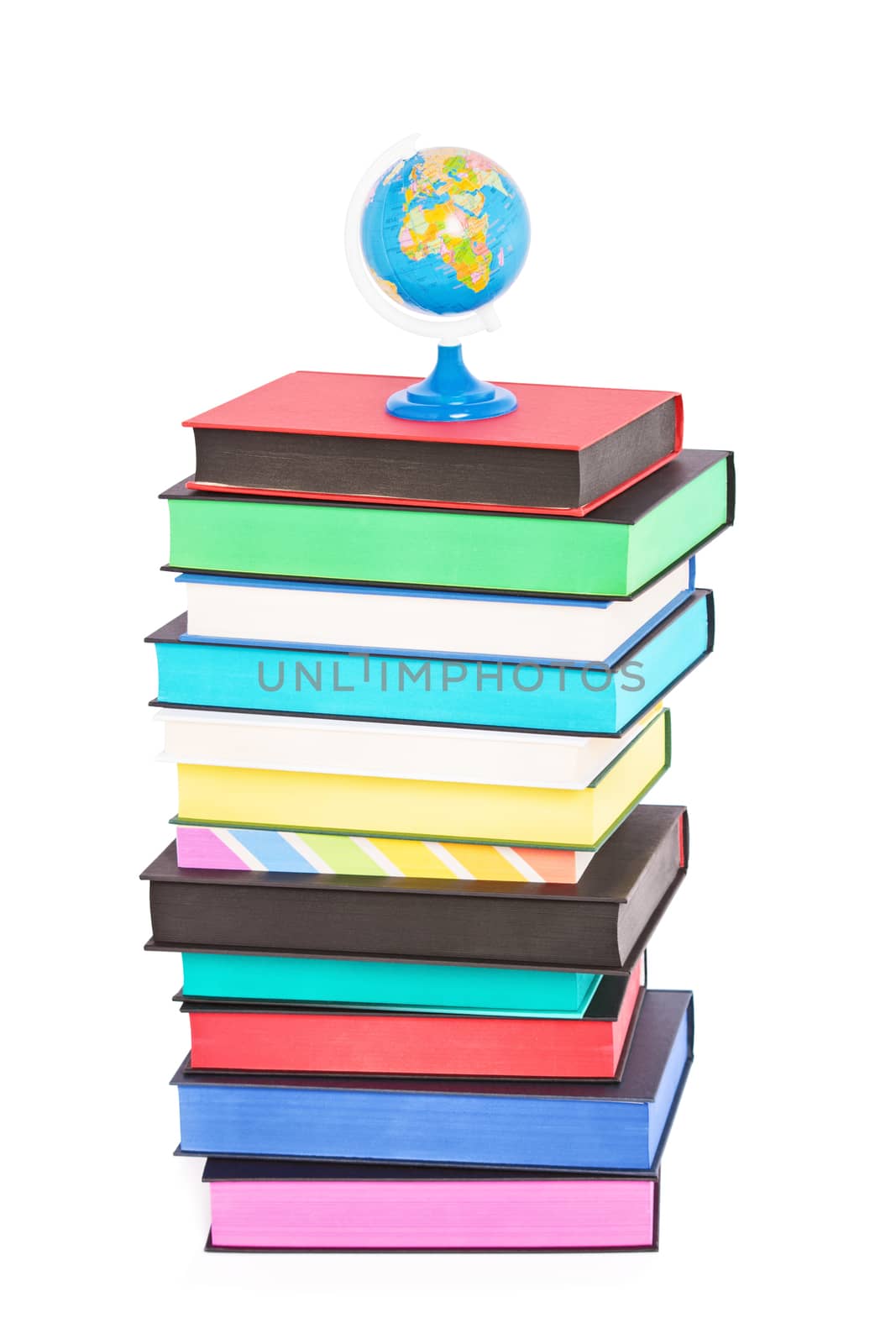 A globe on top of stack of colorful books with different sprayed edges, isolated on white background. Education and travel concept.