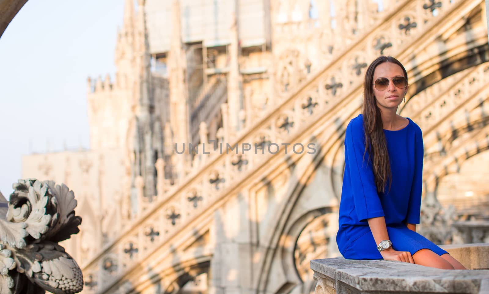 Beautiful woman on the rooftop of Duomo, Milan, Italy by travnikovstudio