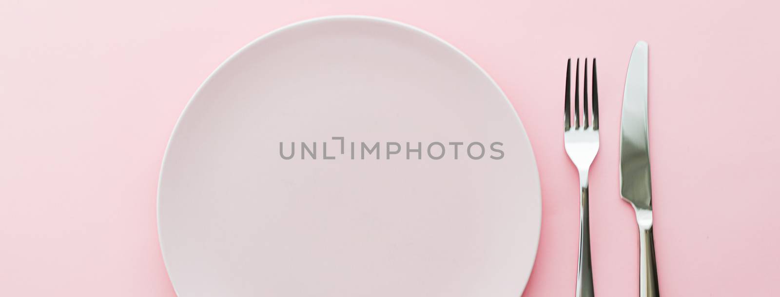 Empty plate and cutlery as mockup set on pink background, top tableware for chef table decor and menu branding design