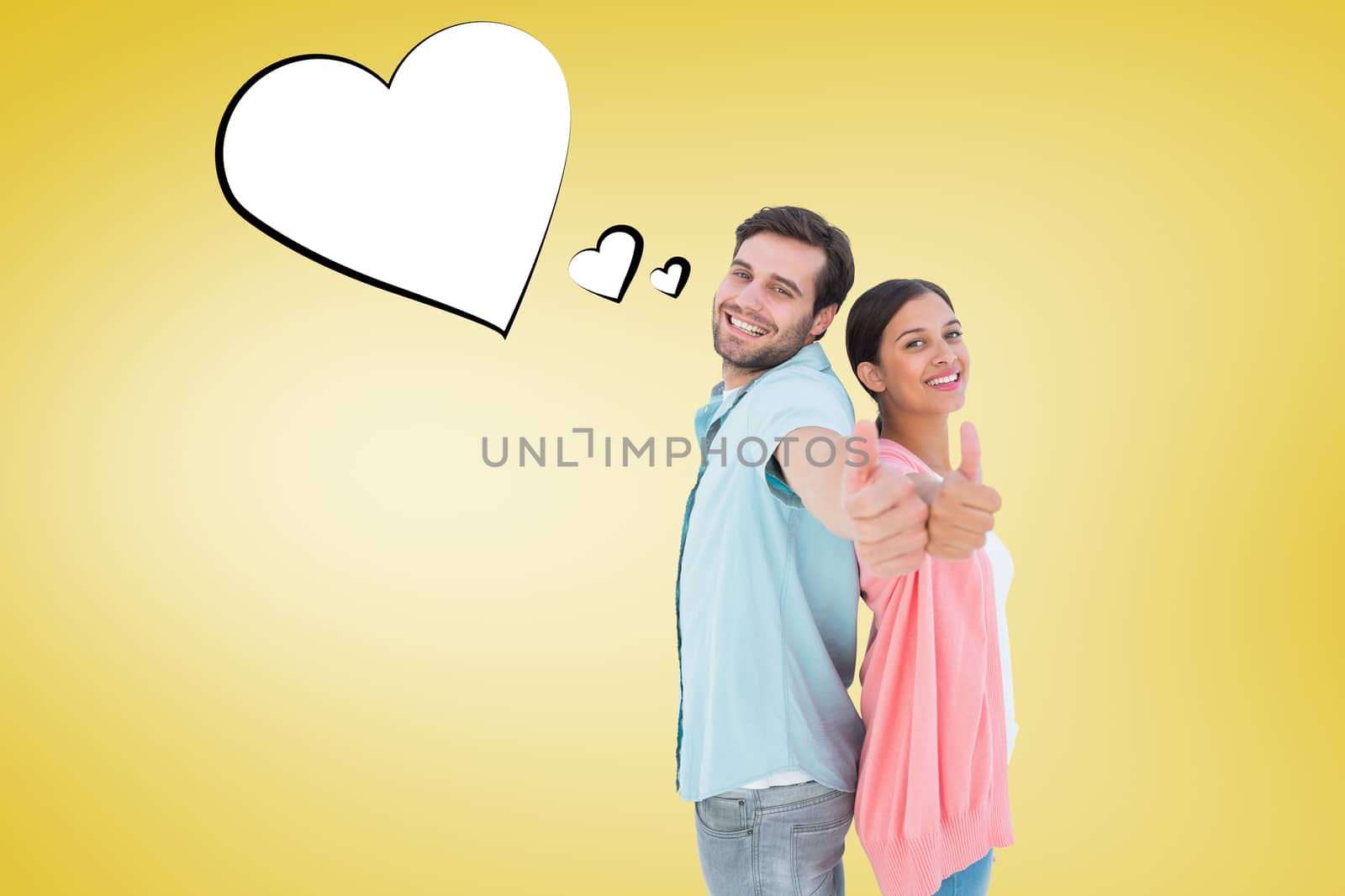 Happy couple showing thumbs up against yellow vignette