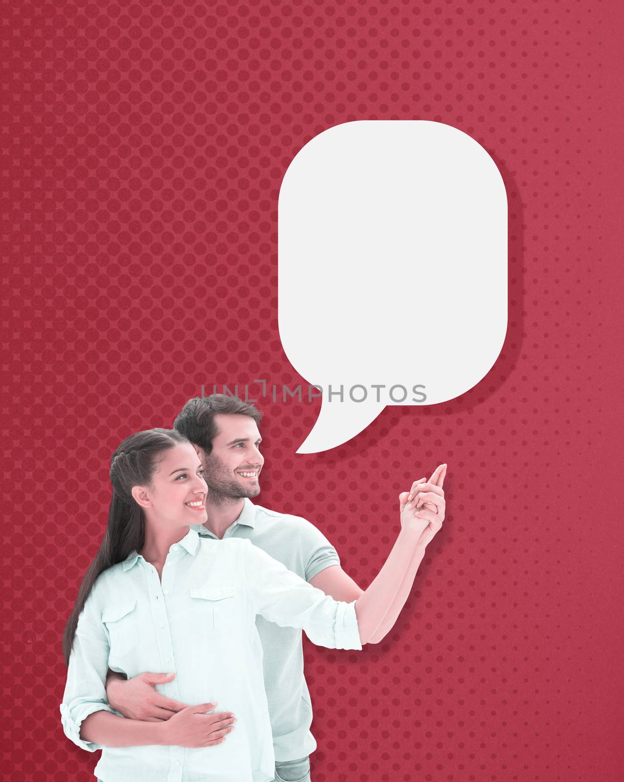 Cute couple embracing and pointing against red