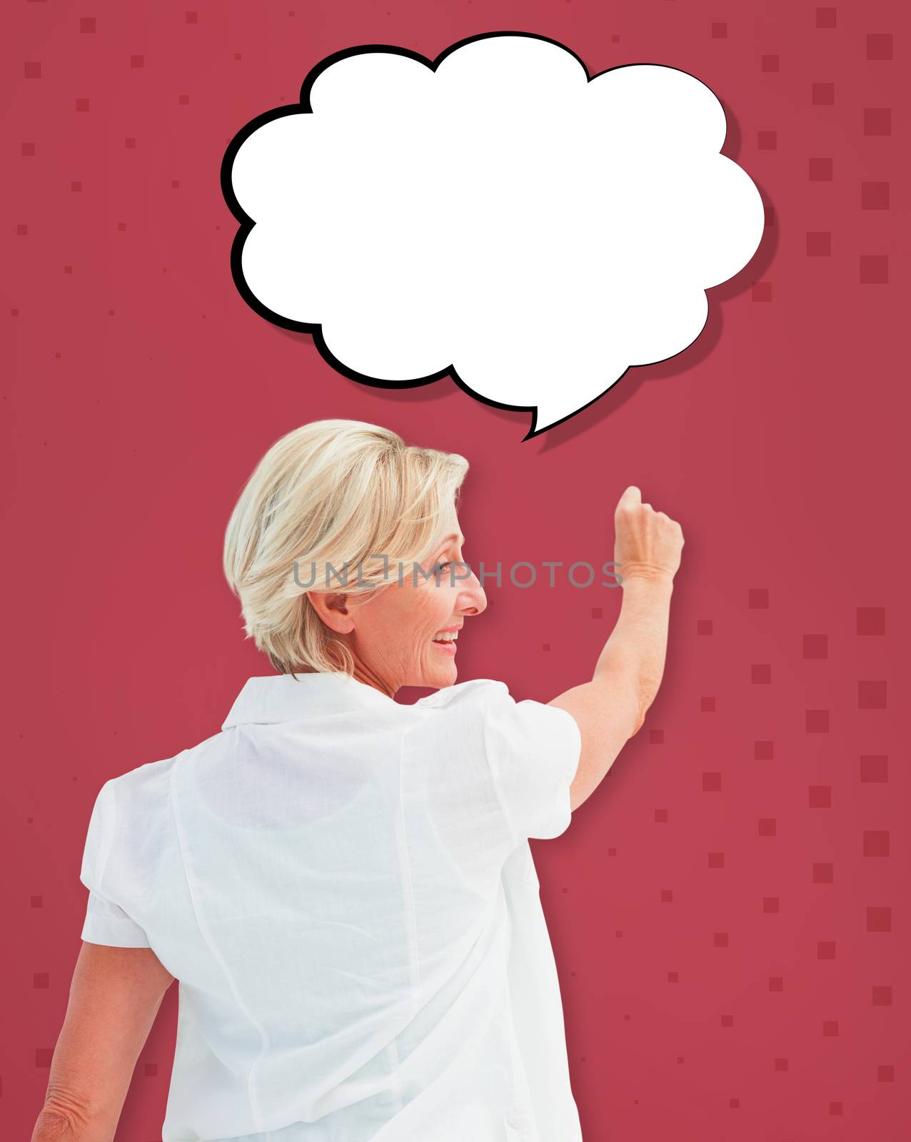 Composite image of happy mature woman writing and smiling by Wavebreakmedia