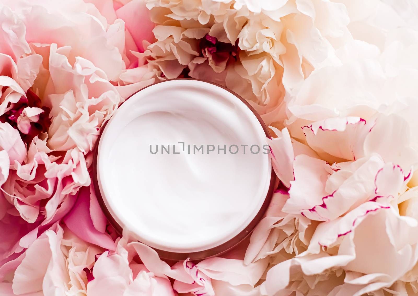 Luxe cosmetic cream jar as antiaging skincare routine product on background of peony flowers, body moisturizer and beauty branding design