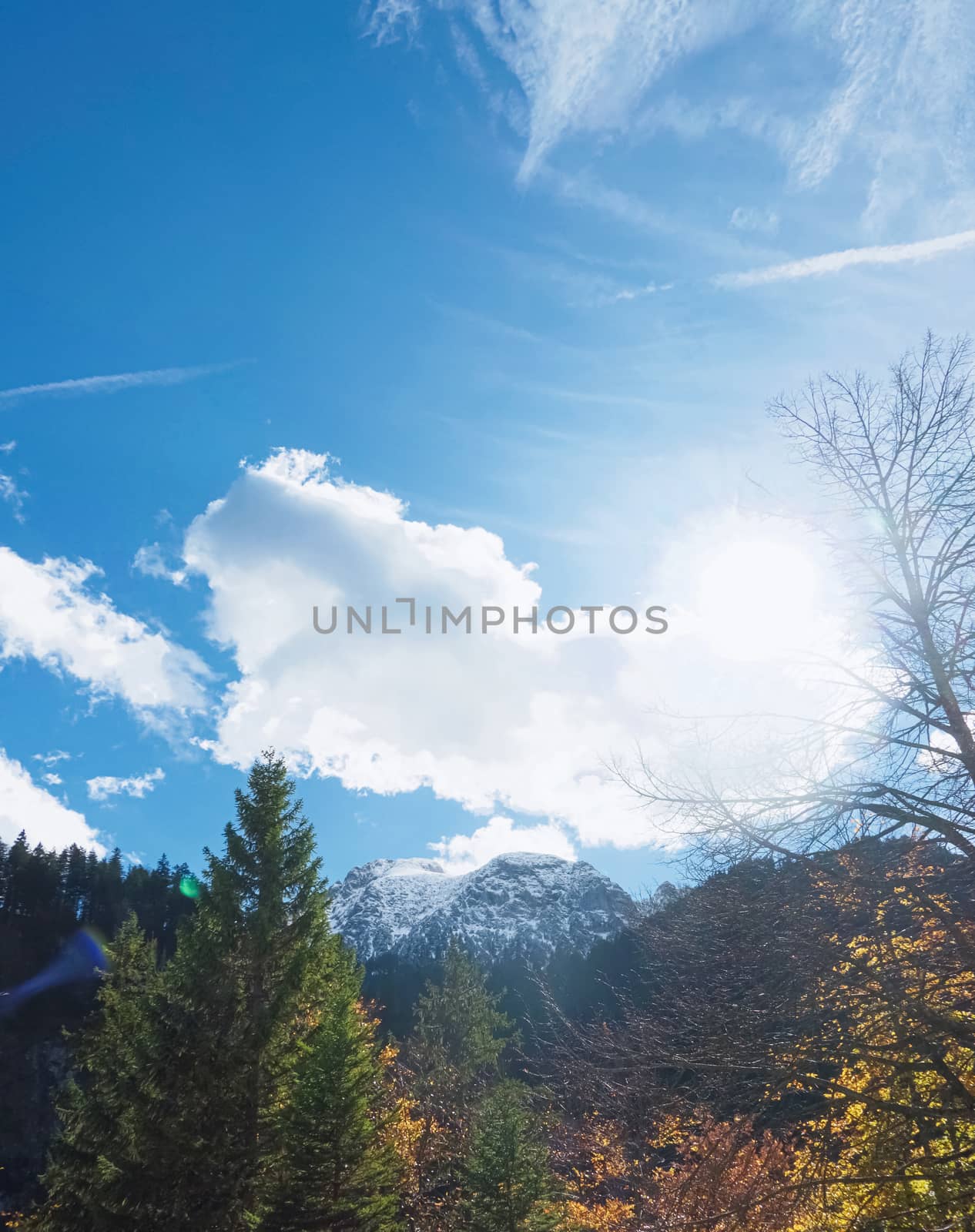 Beautiful nature of European Alps, landscape view of alpine mountains, lake and village on a sunny day, travel and destination by Anneleven