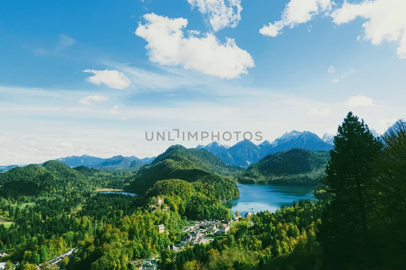 Beautiful nature of European Alps, landscape view of alpine mountains, lake and village in spring season, travel and destination by Anneleven