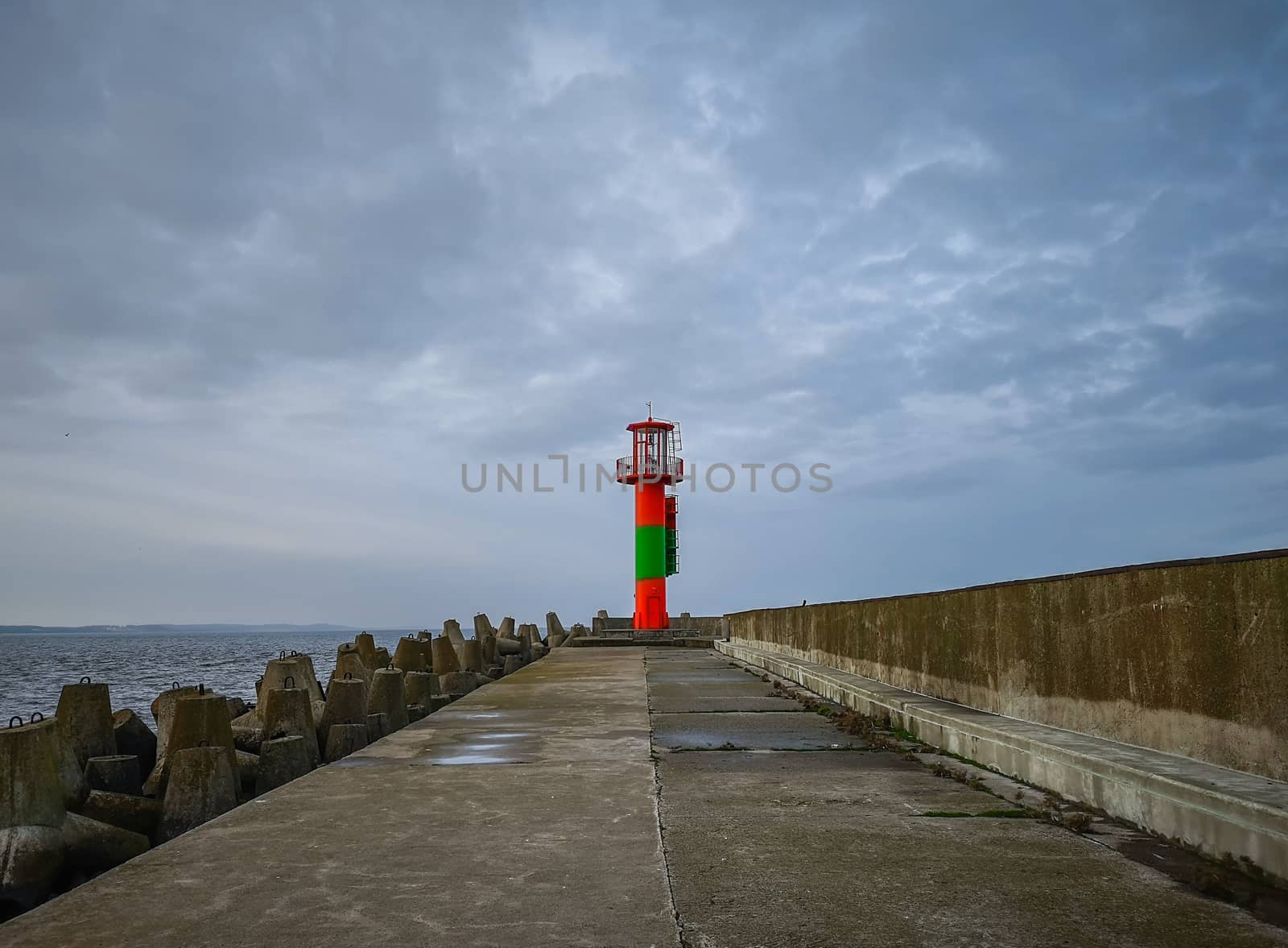 Colorful lantern at end of the breakwater in Swinoujscie city