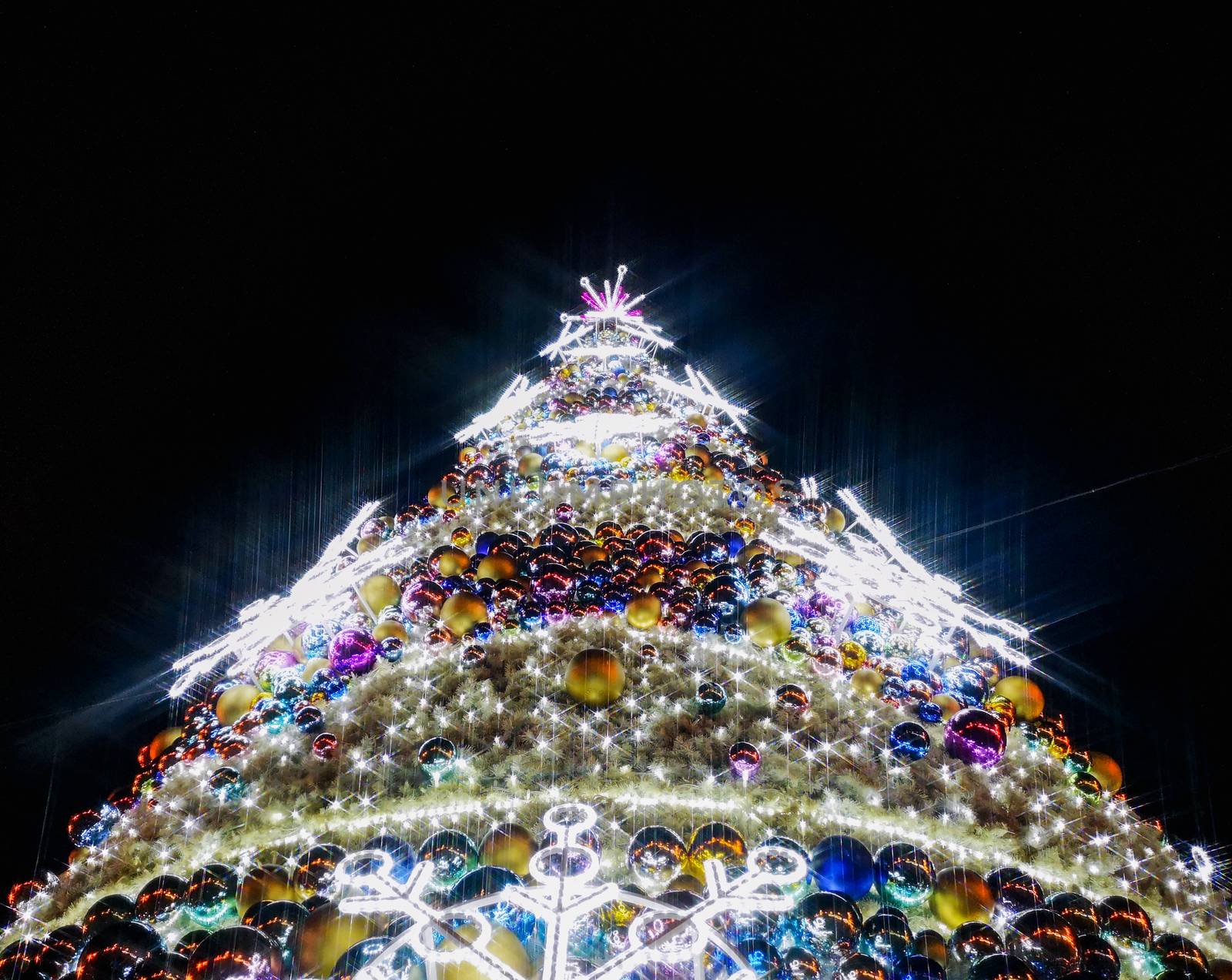 Colorful christmas tree with glowing decorations at Wroclaw market square