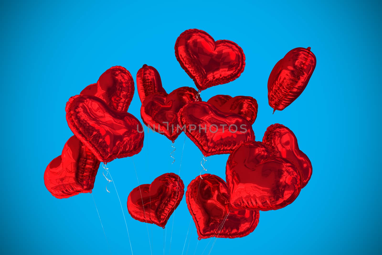 Heart balloons against blue background with vignette