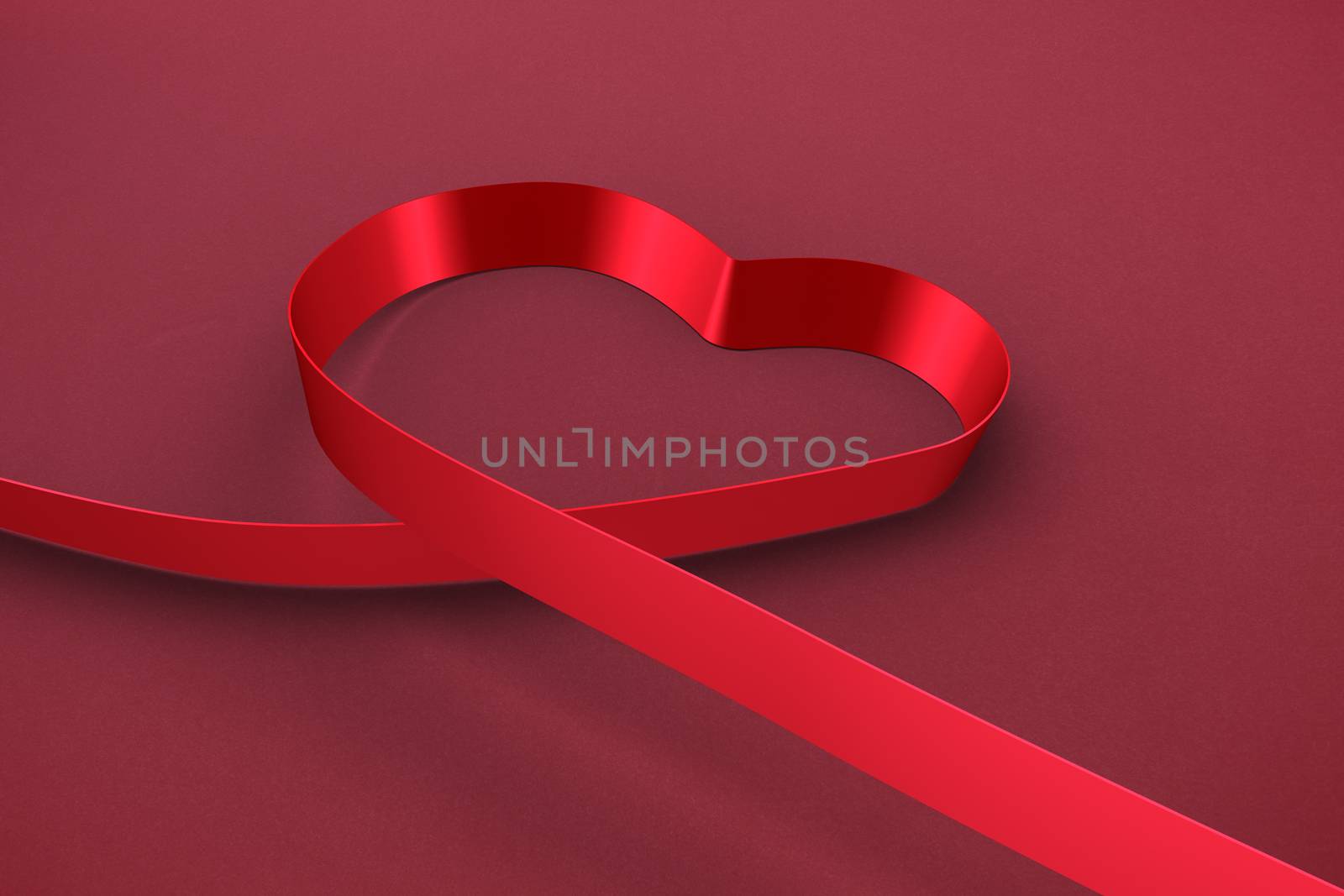 Red ribbon heart against red