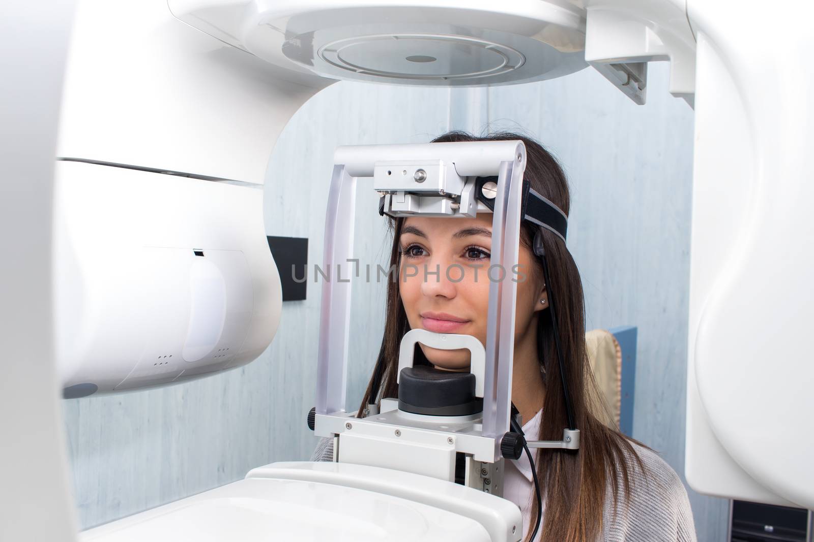 Girl taking digital 3D panoramic dental x-ray. by karelnoppe