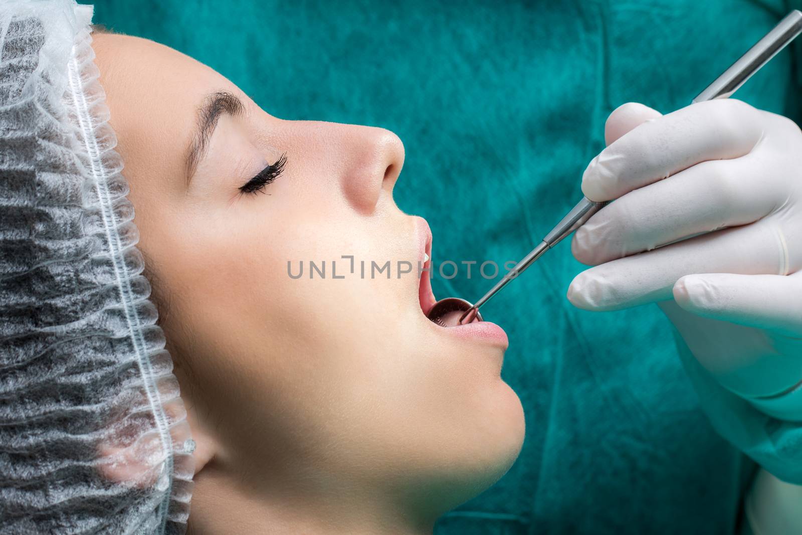 Female patient ready for dental operation. by karelnoppe