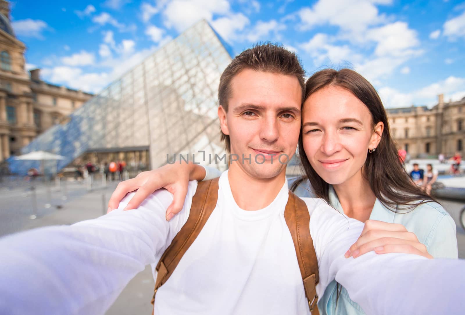 Romantic young couple taking selfie in Paris by travnikovstudio