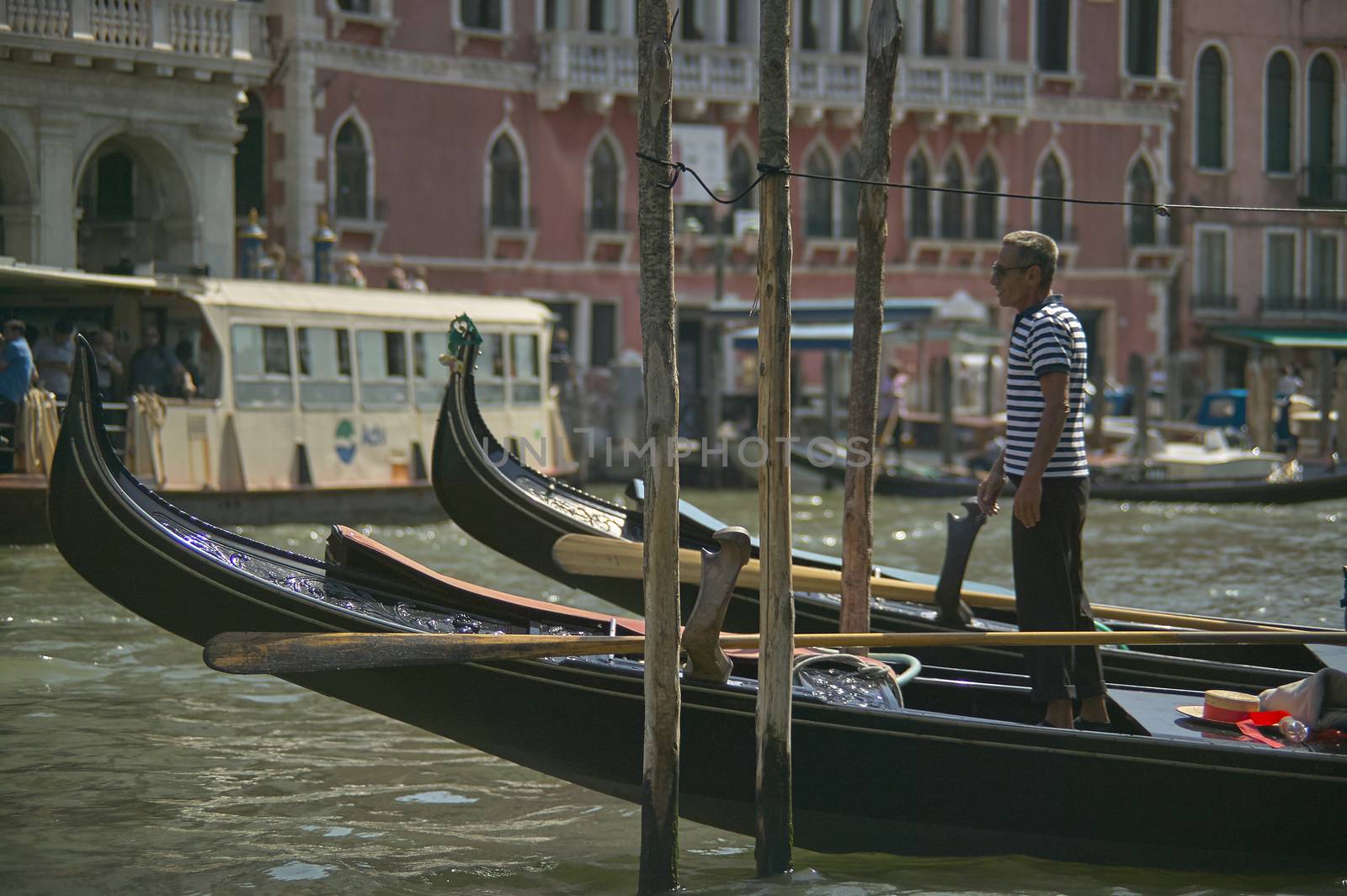 VENICE, ITALY 25 MARCH 2019: Gondola in Venice with people on board