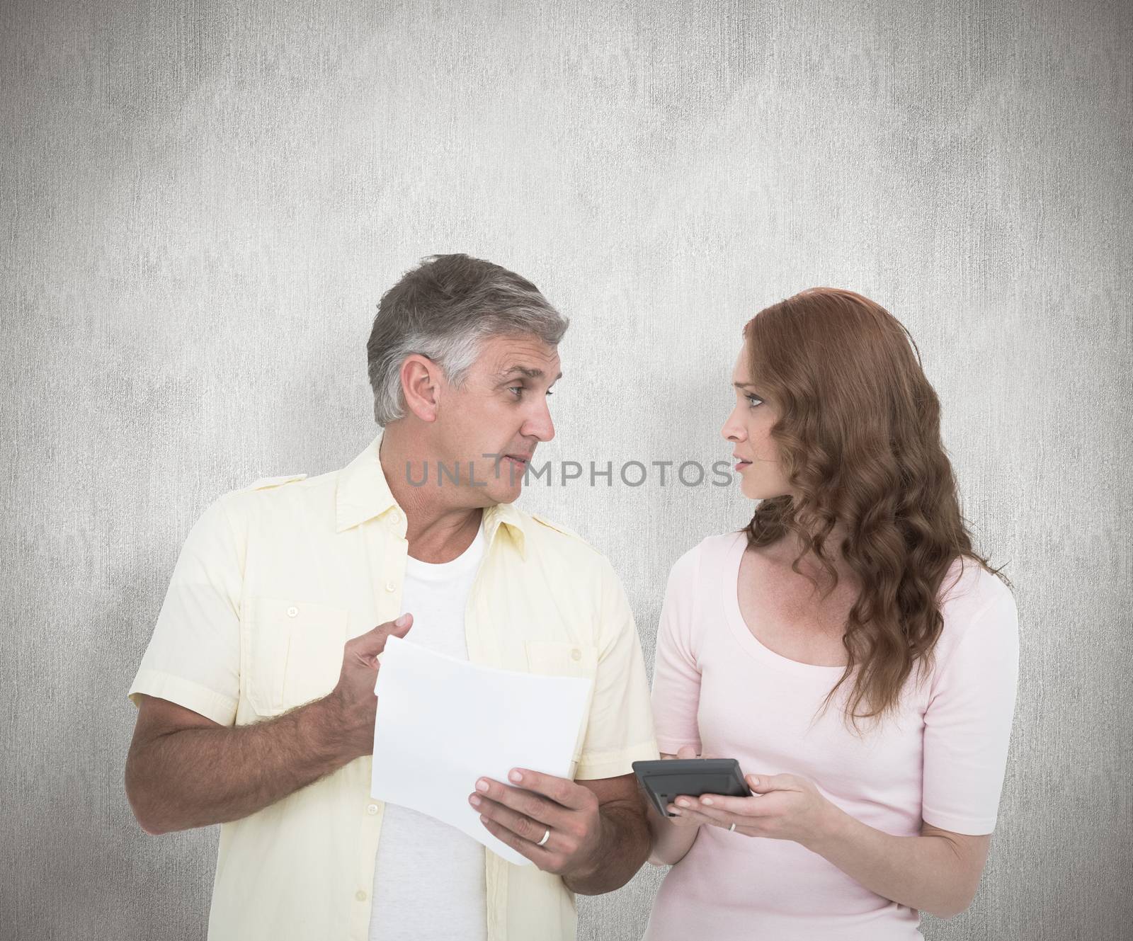 Composite image of casual couples working out their bills by Wavebreakmedia