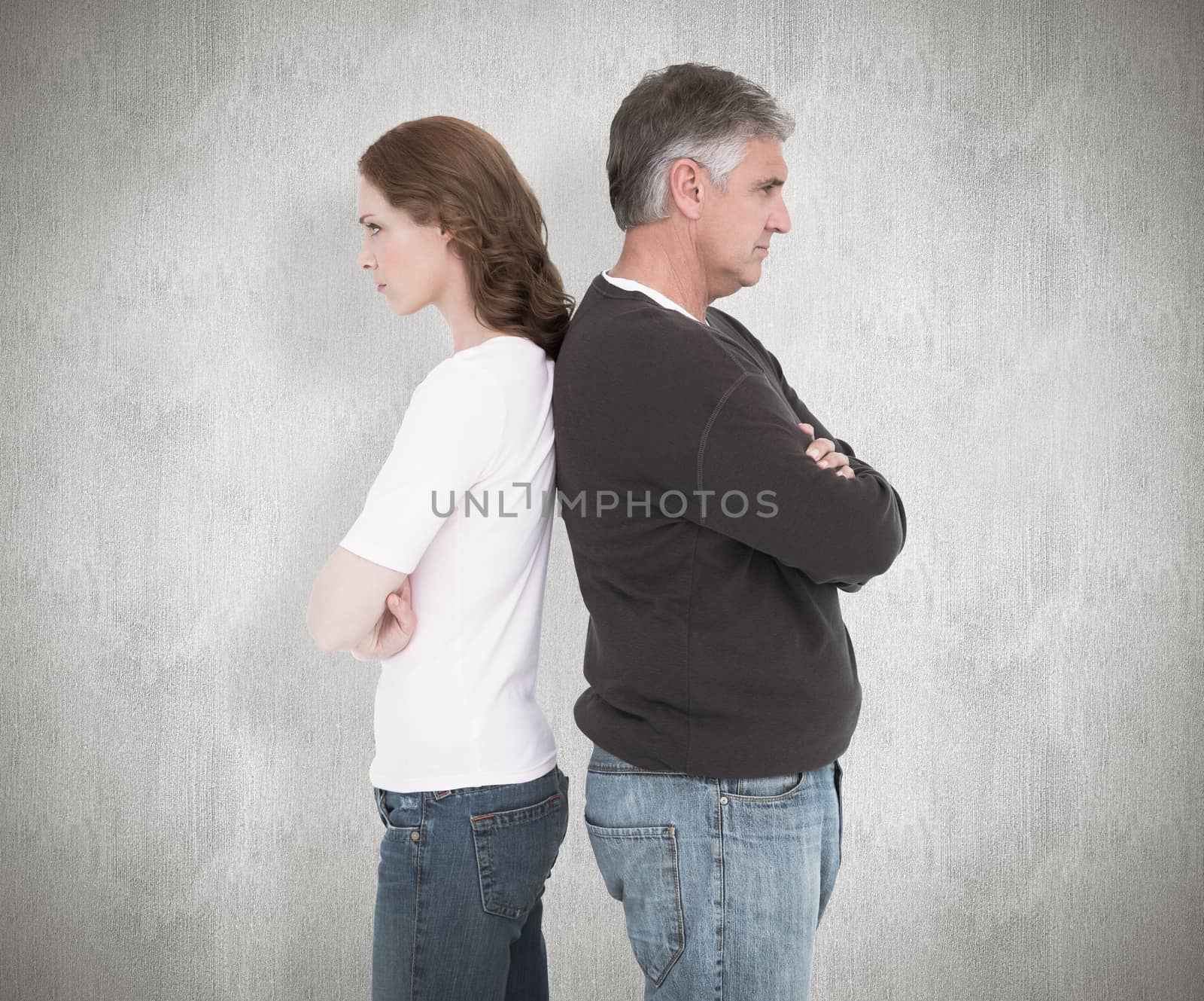 Casual couple not speaking after fight against white background