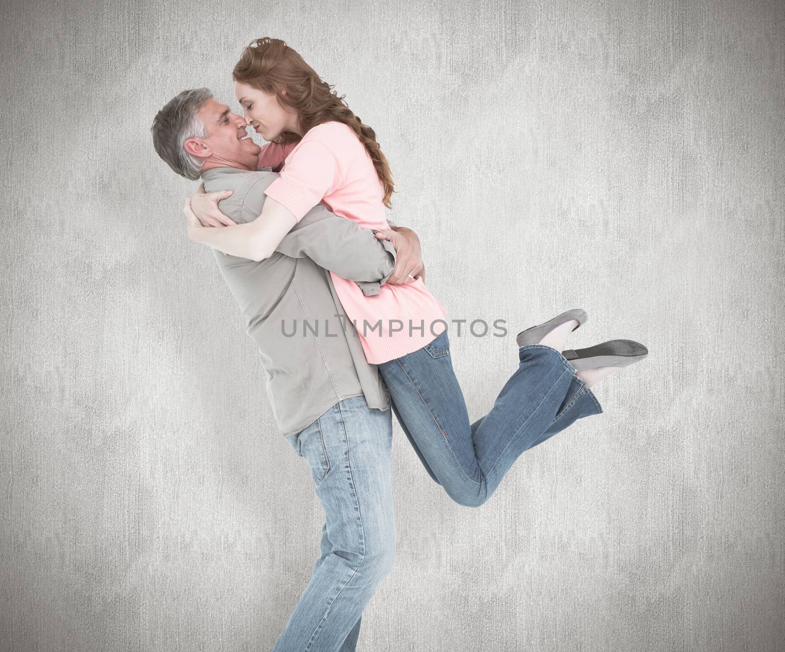 Composite image of casual couple hugging each other by Wavebreakmedia