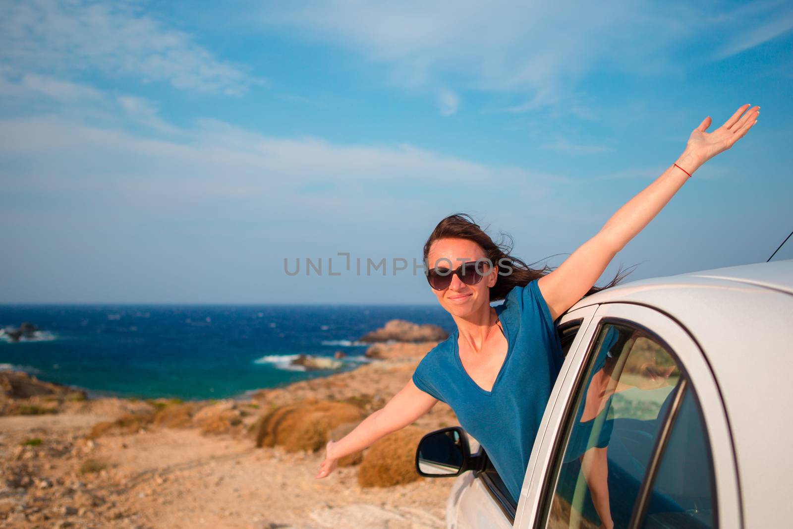 Happy girl on vacation travel by car. Summer holiday and car travel concept. by travnikovstudio