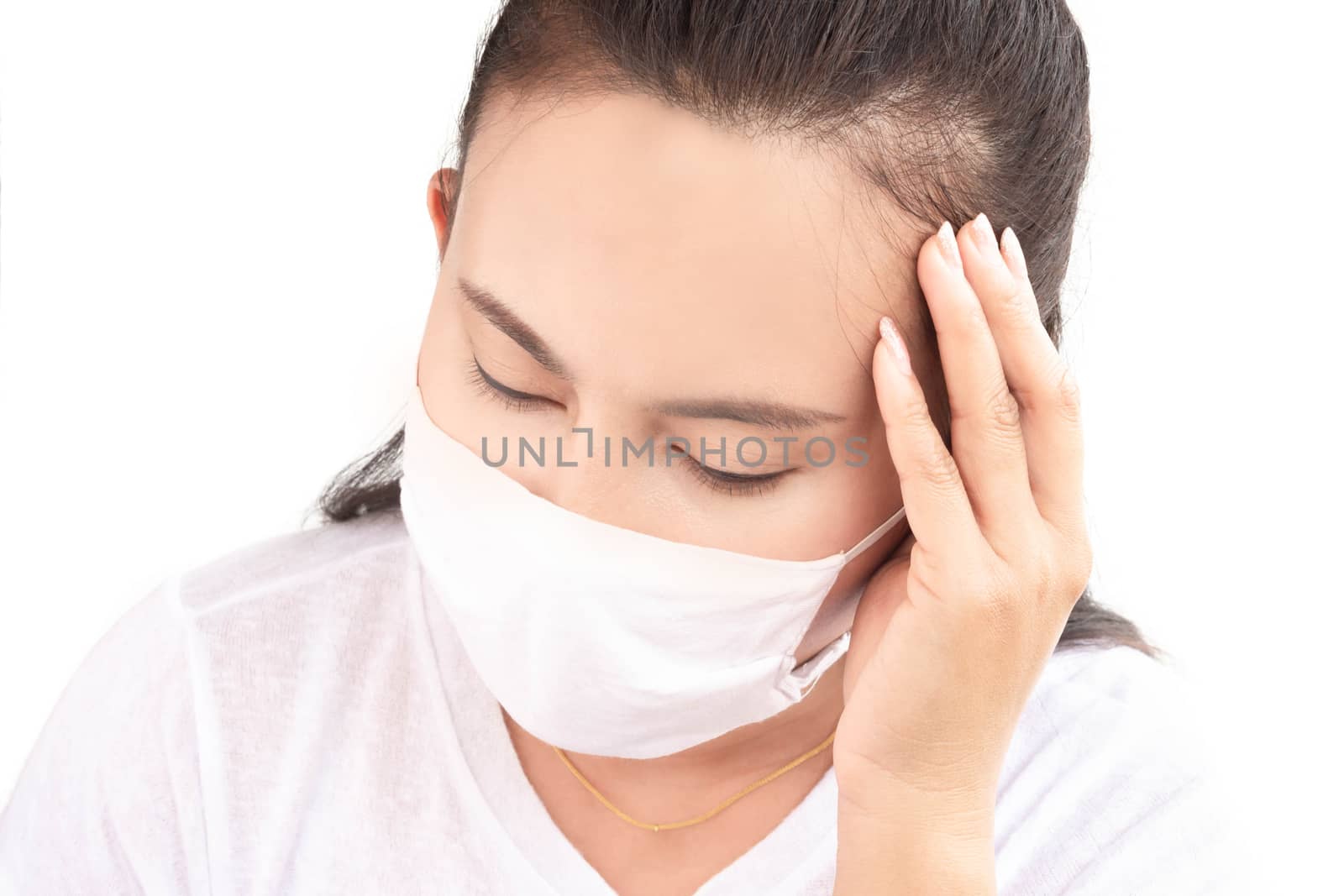 Closeup woman wearing face mask for protect air polution with white background, health care and medical concept