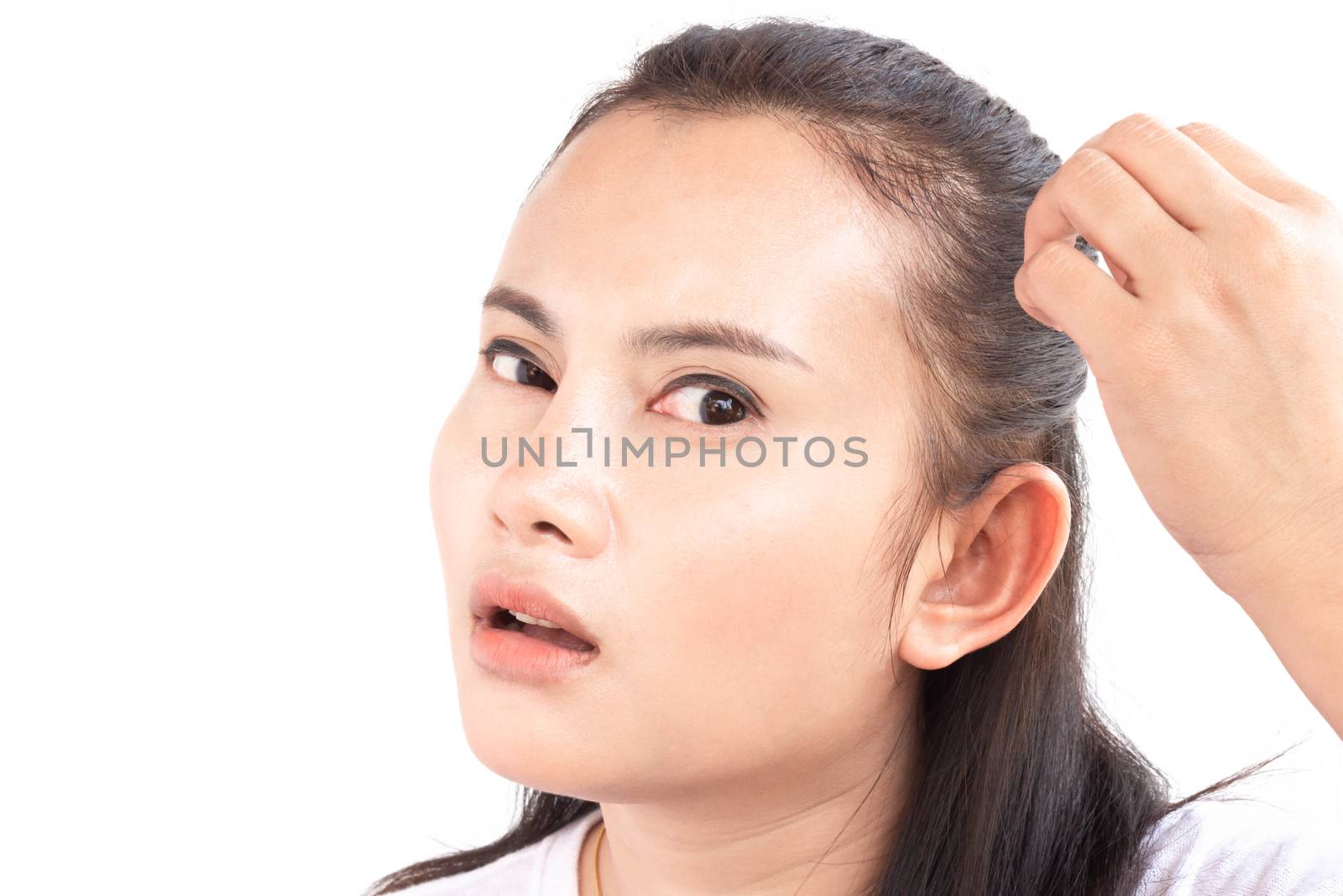 Close up woman hand holding hair loss problem for health care sh by pt.pongsak@gmail.com