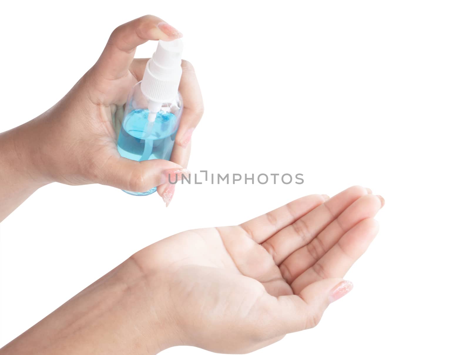 Woman hand using alcohol spray in plastic bottle for washing hand, health care and medical concept