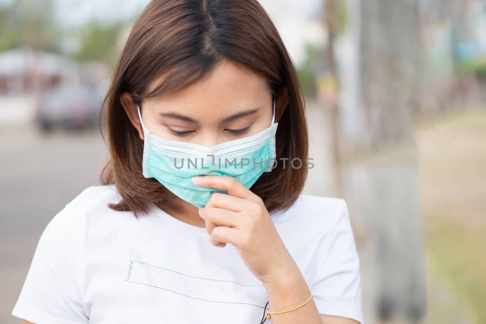 Closeup woman wearing face mask for protect air polution, health by pt.pongsak@gmail.com