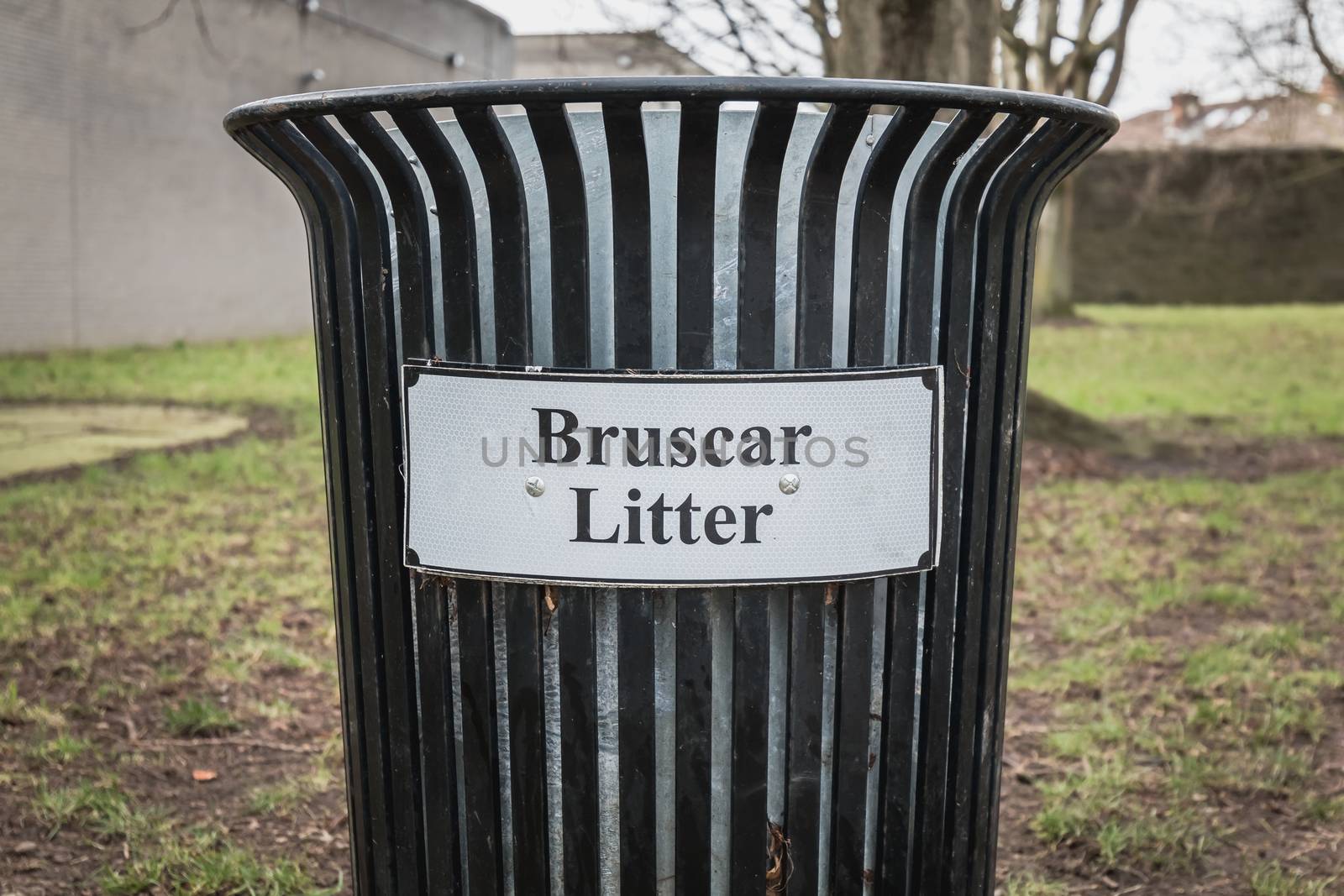 Trash timber litter bin Bruscar in a public park in Ireland near Dublin