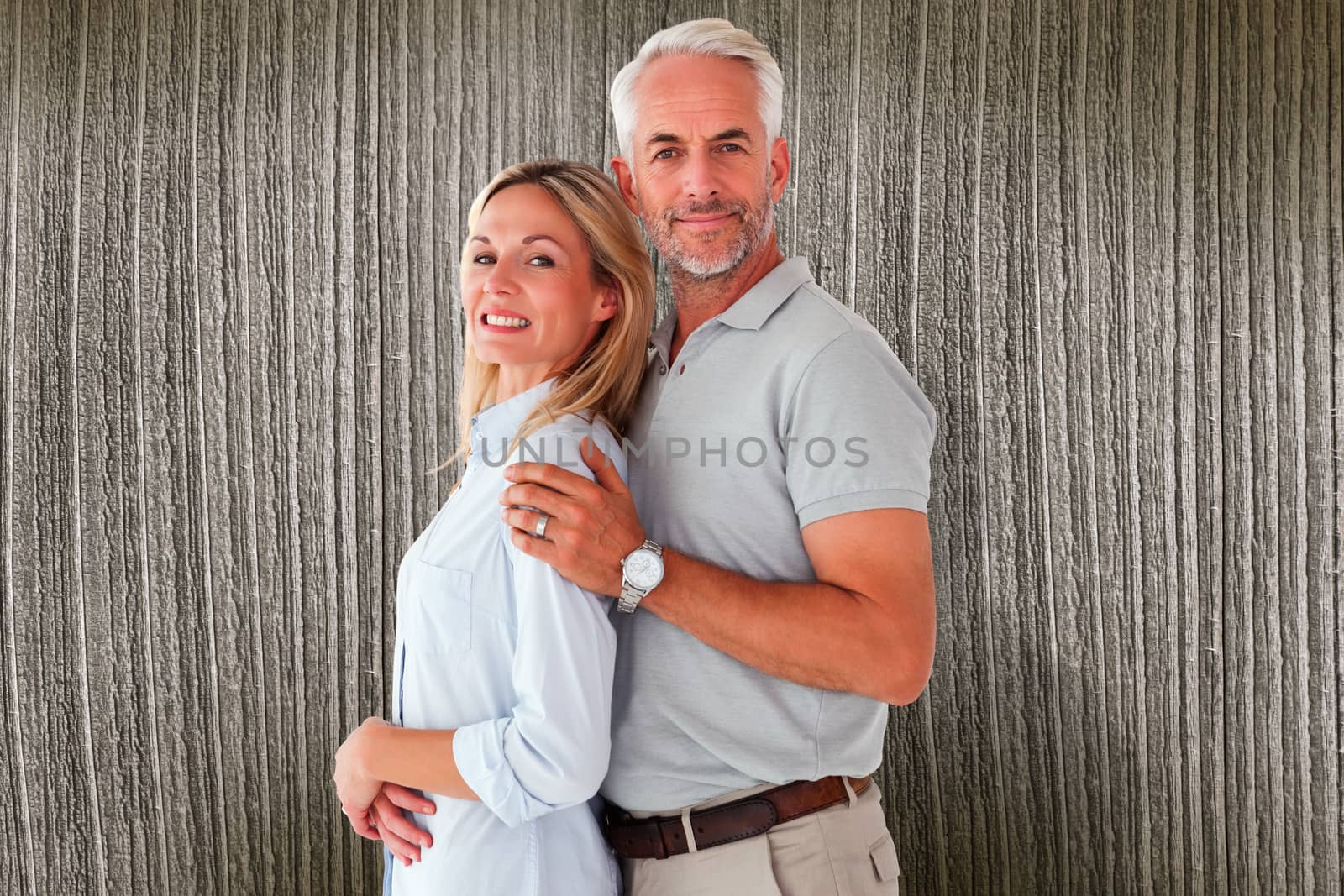 Composite image of happy couple smiling at camera by Wavebreakmedia