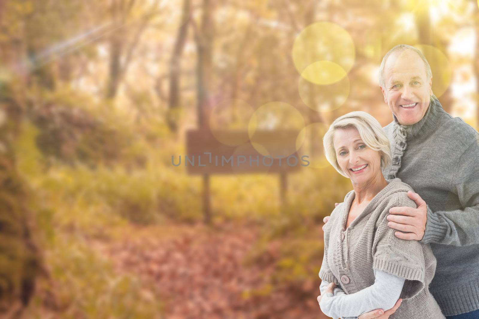 Composite image of mature winter couple by Wavebreakmedia