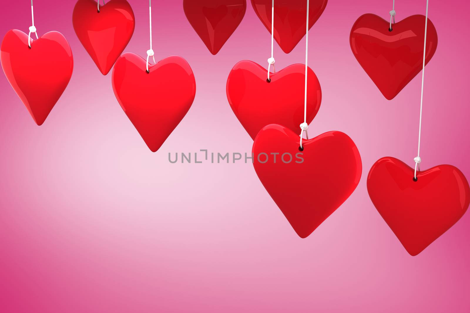 Love hearts against pink vignette