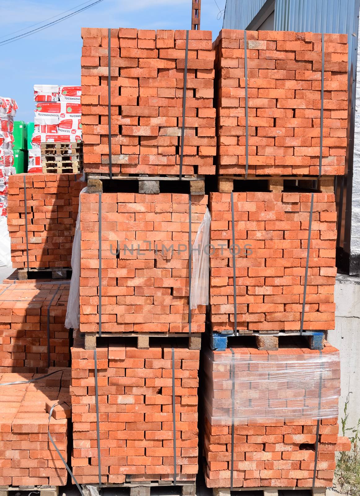 Bricks on pallets. Storage of bricks at the construction site.