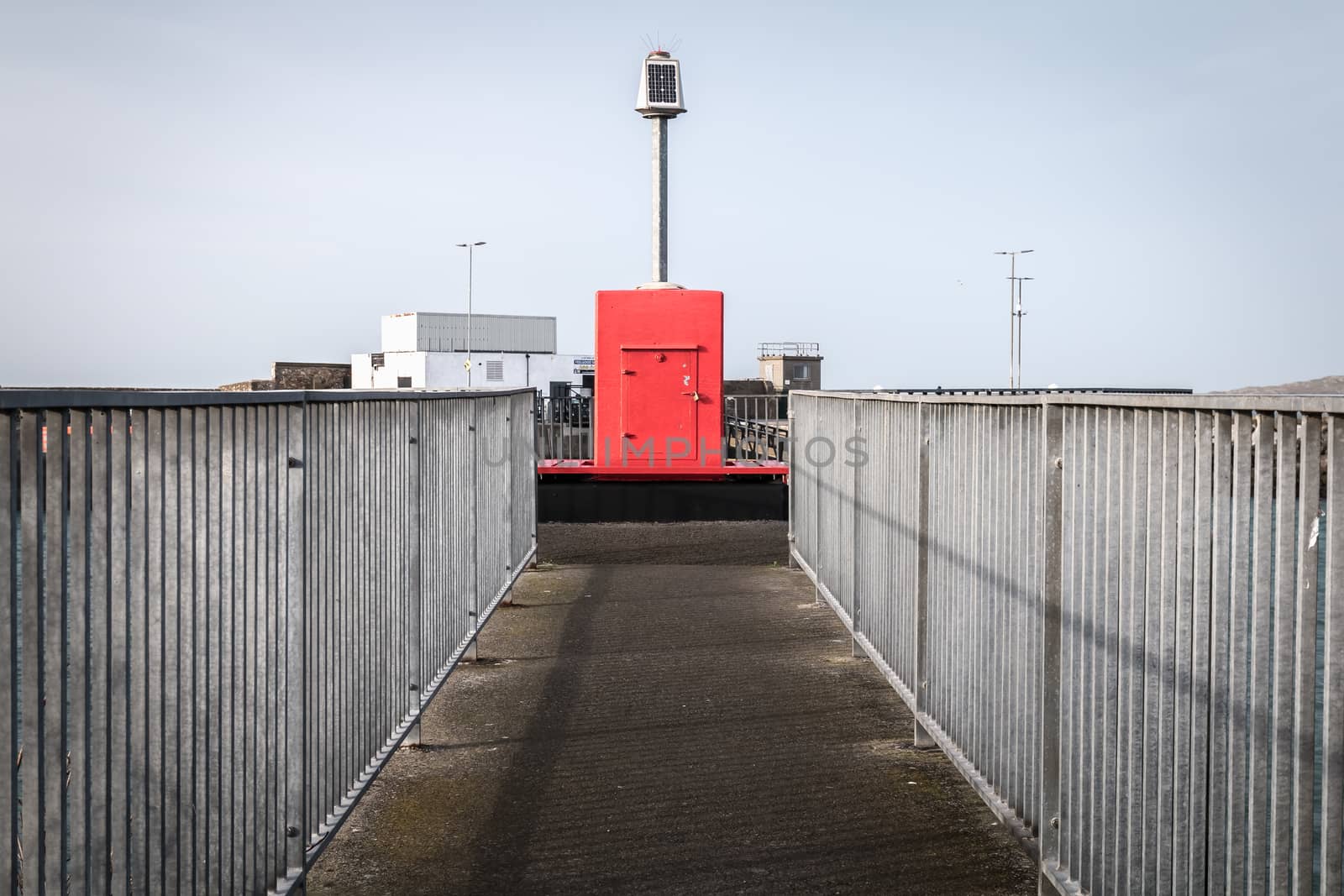 Howth near Dublin, Ireland - February 15, 2019: Illuminated signal for boat guidance at the entrance to Howth harbor on a winter day