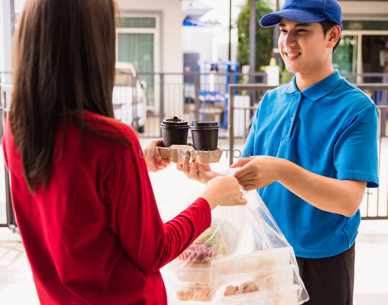 Delivery man making grocery service giving rice food boxes plast by Sorapop